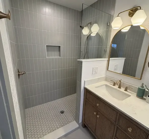 Bathroom remodel with gray tile shower and new vanity, Austin area